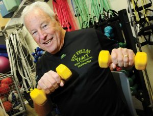Barrie Chapman of Fit Fellas demonstrates an exercise using weights